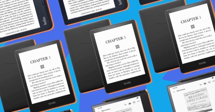A hand holding up the Kindle Paperwhite