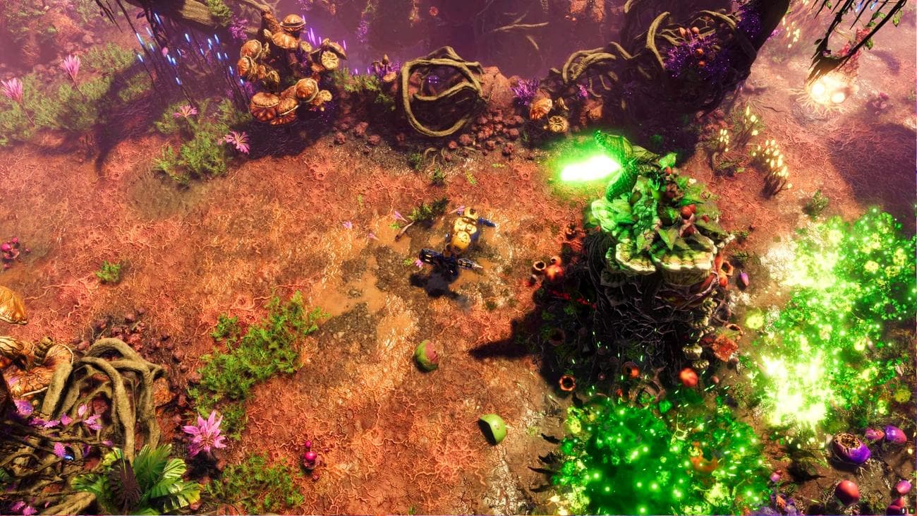 The Riftbreaker Heart of the Swarm DLC - Ένας μηχανικός πλησιάζει μια γιγάντια ανάπτυξη μυκήτων που εκτοξεύει πράσινο γκαζόν.