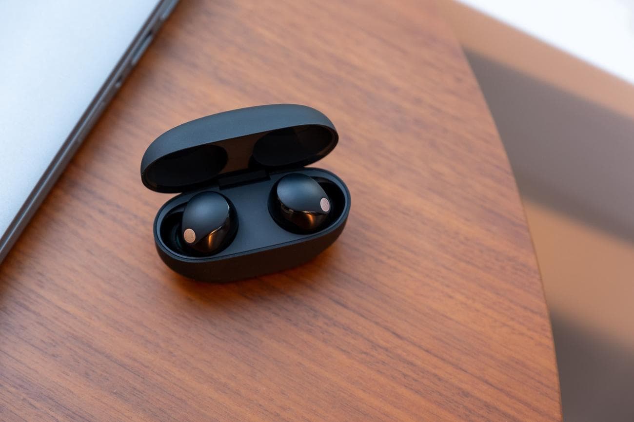 A photo of Sony's WF-1000XM5 earbuds.