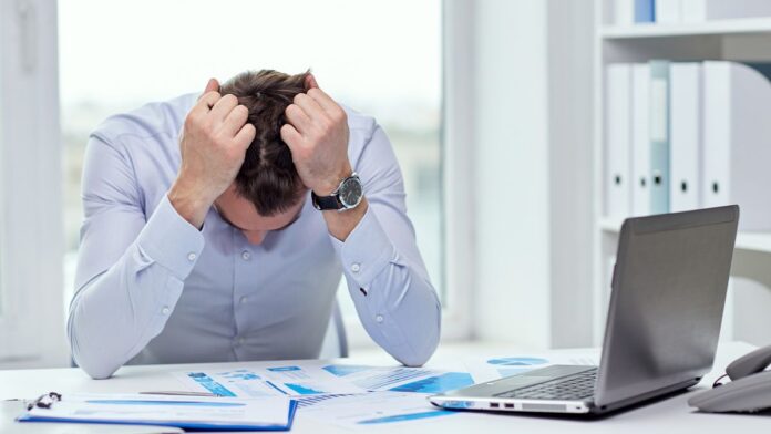 Unhappy looking laptop user